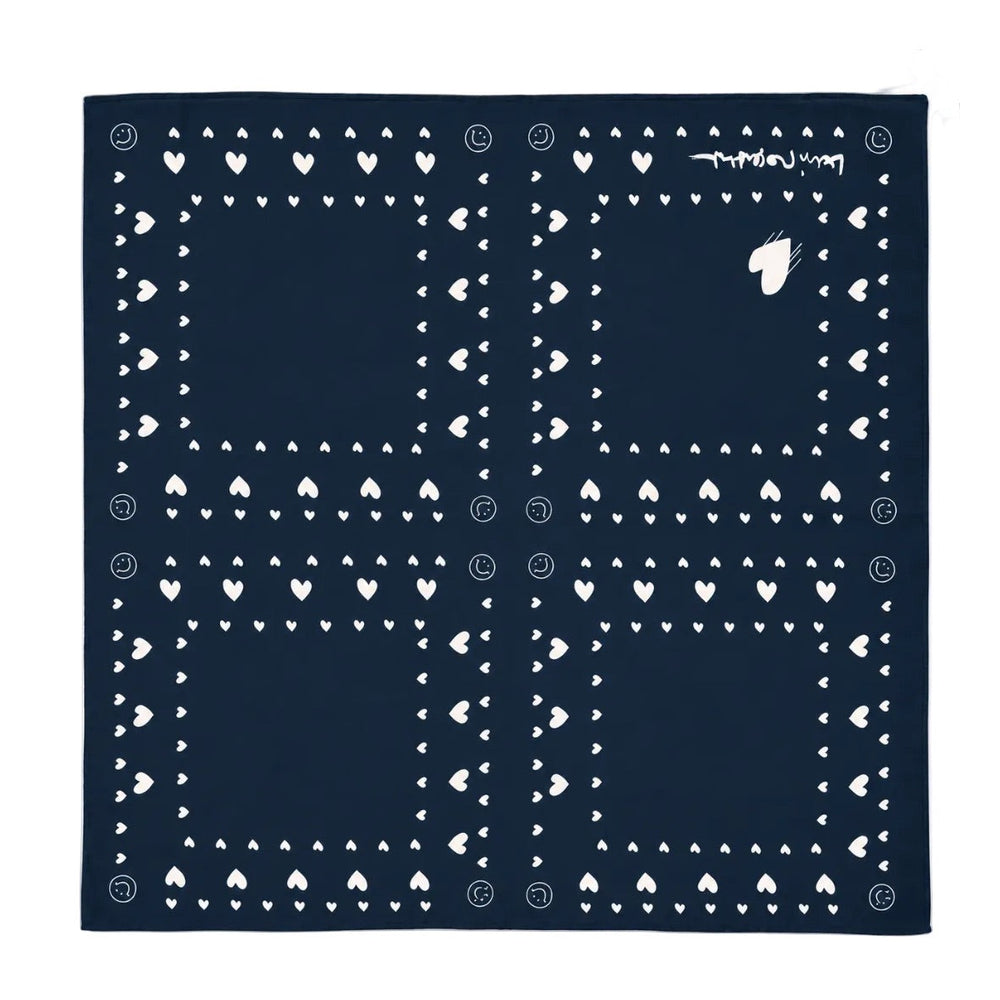Blue bandana scarf with white heart and dot print.