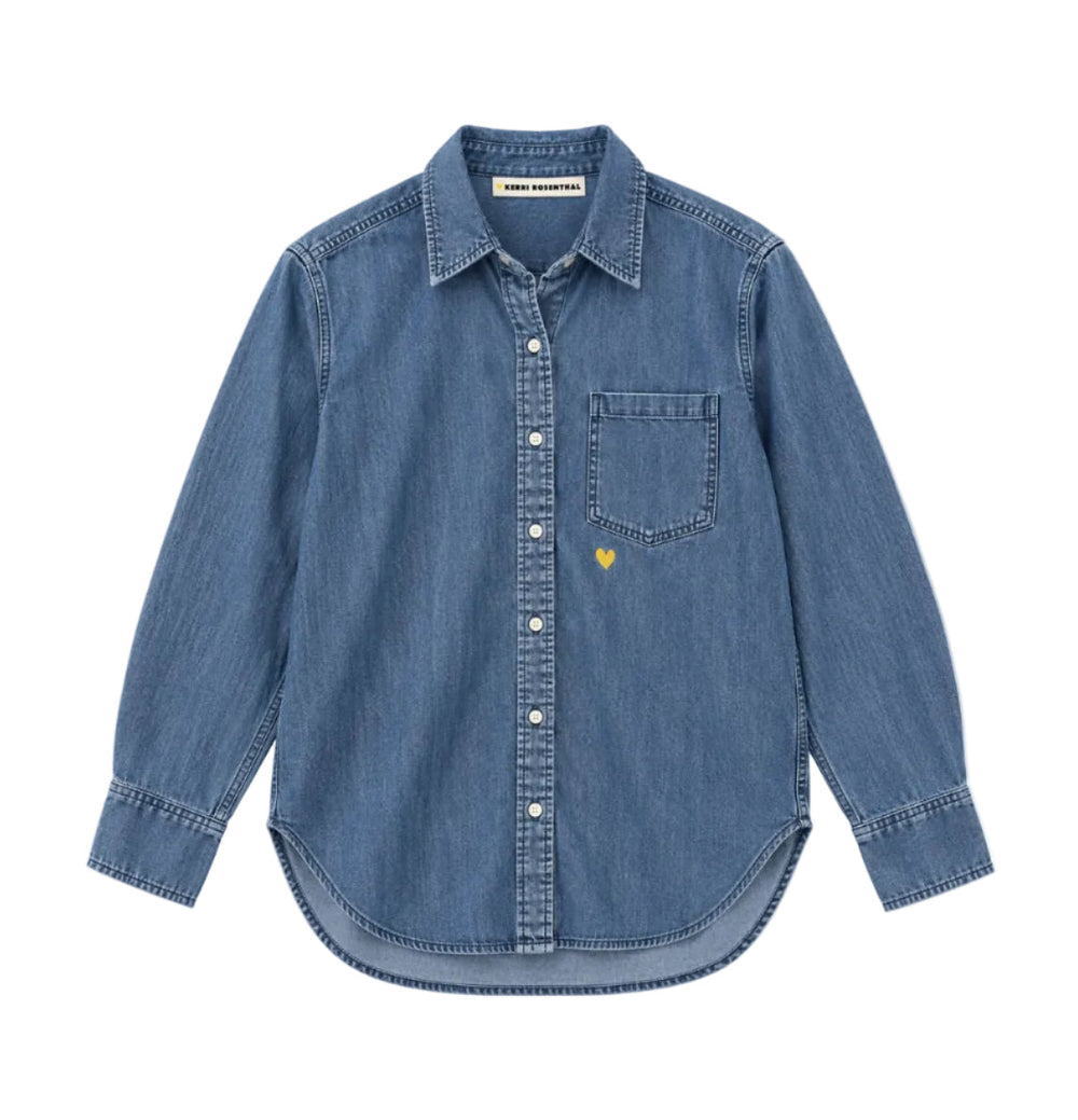 Flat front view of the Mia Denim Shirt in washed denim with a small yellow heart above the chest pocket