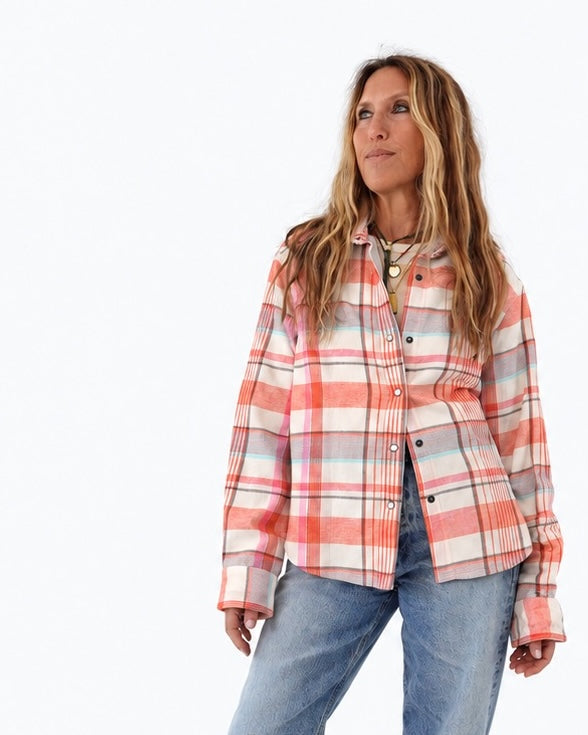 Kerri wearing the Pia Flannel Shirt in coral plaid with jeans, upper body front view