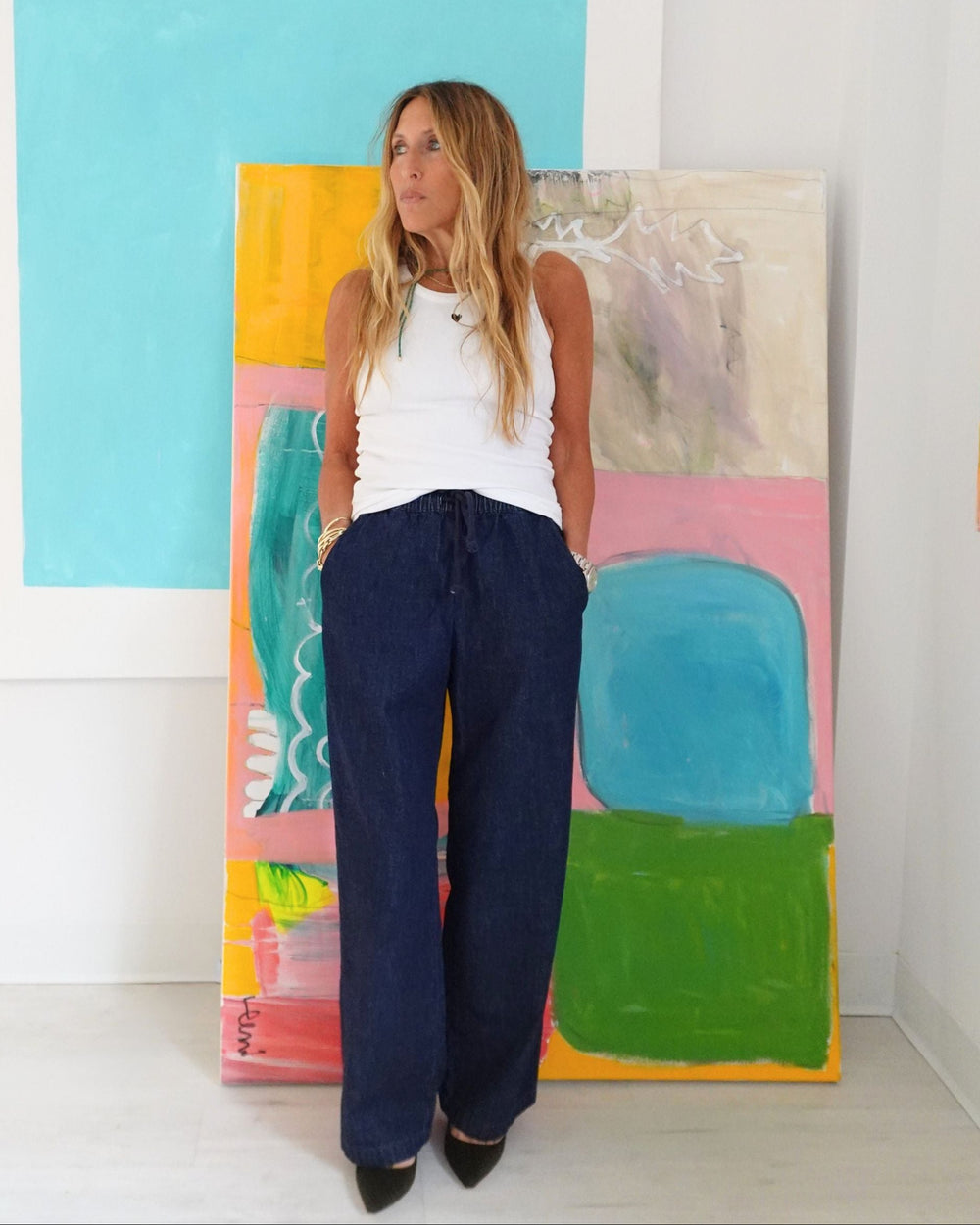 Kerri Rosenthal white tank top with heart detail, front view styled with wide legged denim pants and heels