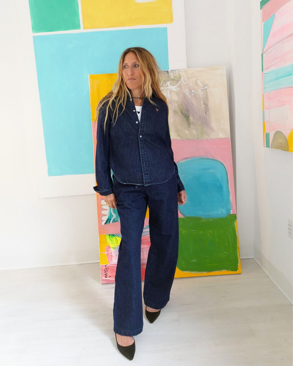 Kerri Rosenthal dark denim button-down shirt, front view styled with jeans and heels