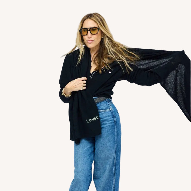 Kerri wearing Femme Ruffle Henley Sweater in Black, styled with Cashmere Wrap.