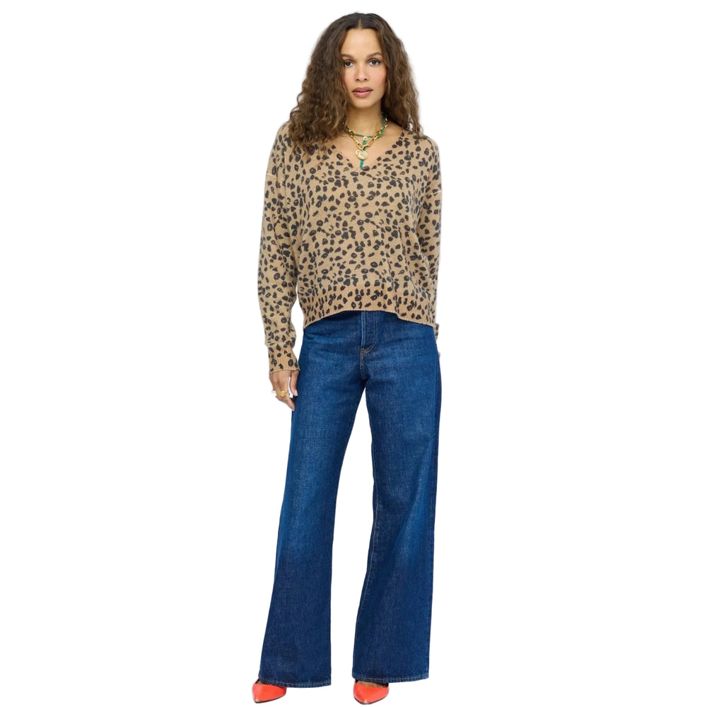 Kerri Rosenthal leopard print top and wide-leg jeans, full-length front view with orange heels