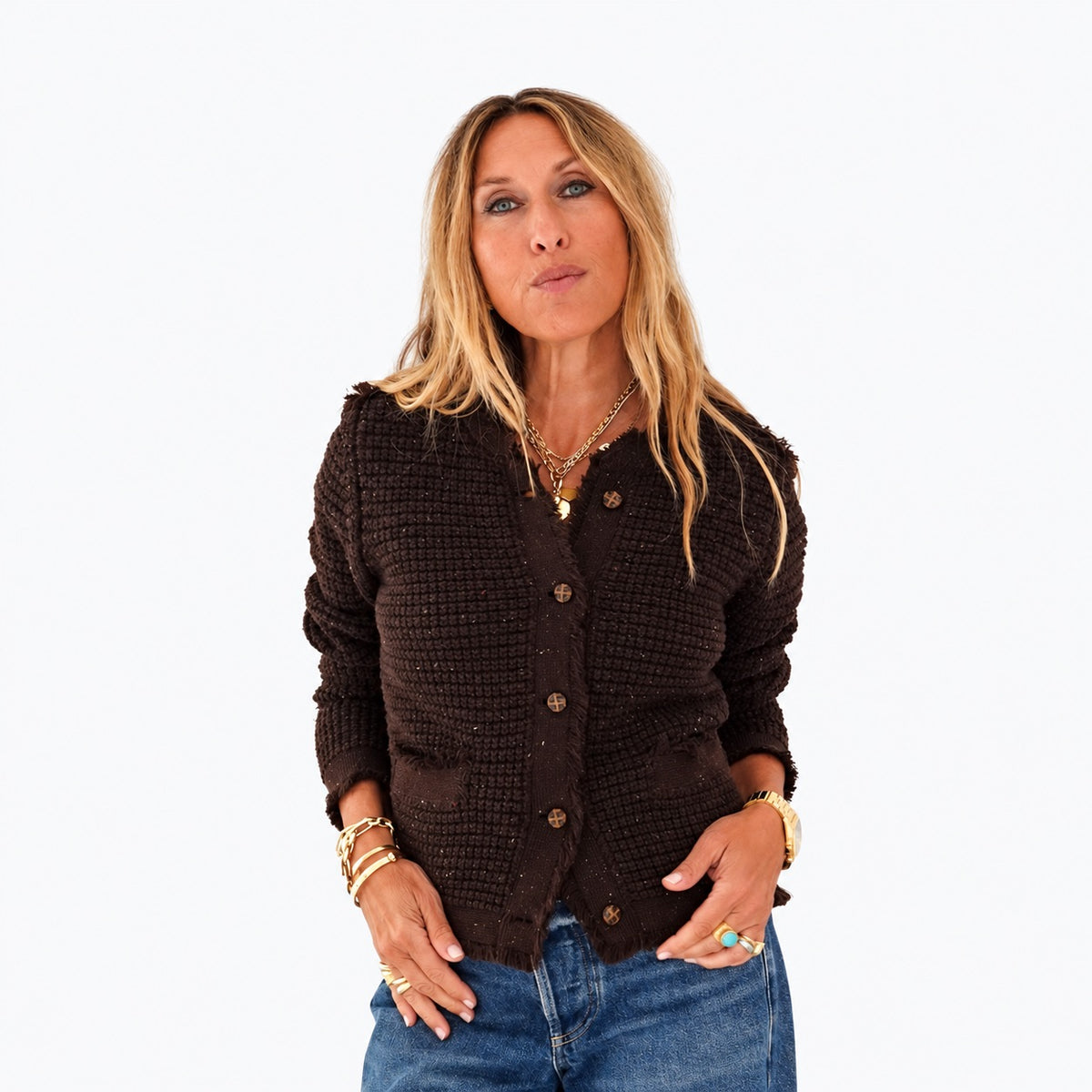 Kerri wearing the Fringe Beau-Lero Cardigan in cocoa heather with jeans, hands in her pockets, front view