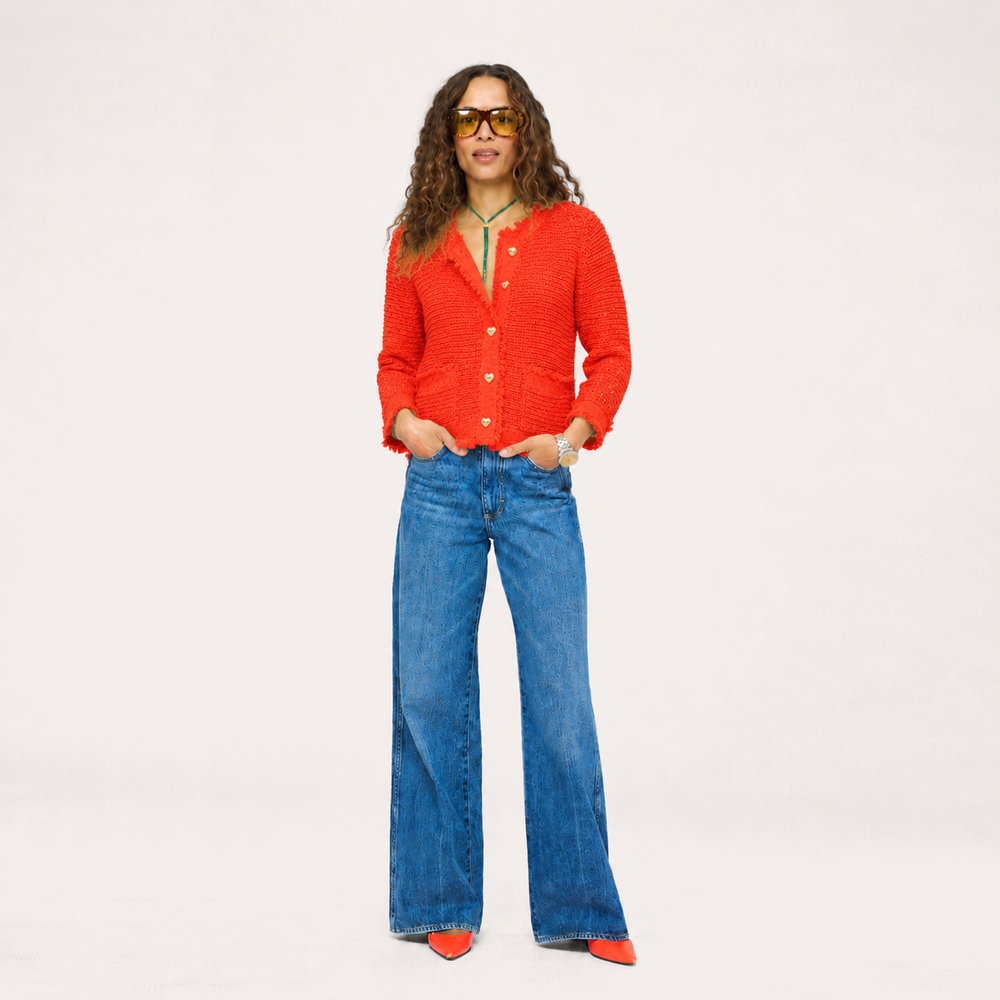 Kerri Rosenthal vermillion boucle tweed fringe jacket with gold heart buttons flat lay.