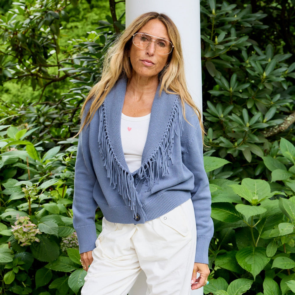 Kerri Rosenthal blue fringe cardigan - front view styled with cream trousers