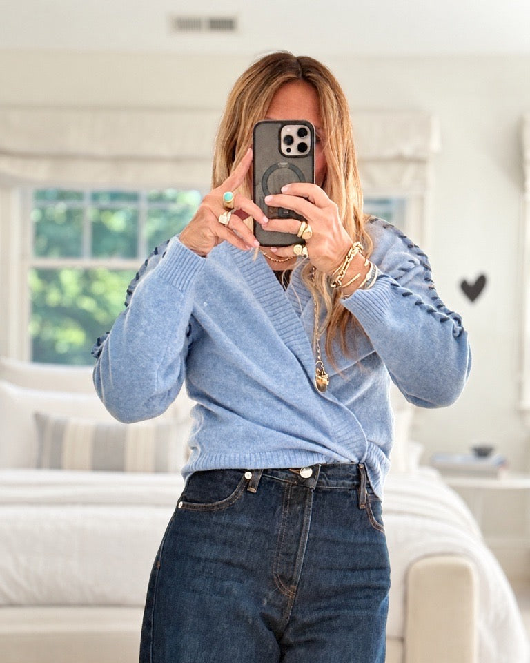 Kerri taking selfie and wearing Sienna Cashmere Cardigan tucked into jeans, in front view