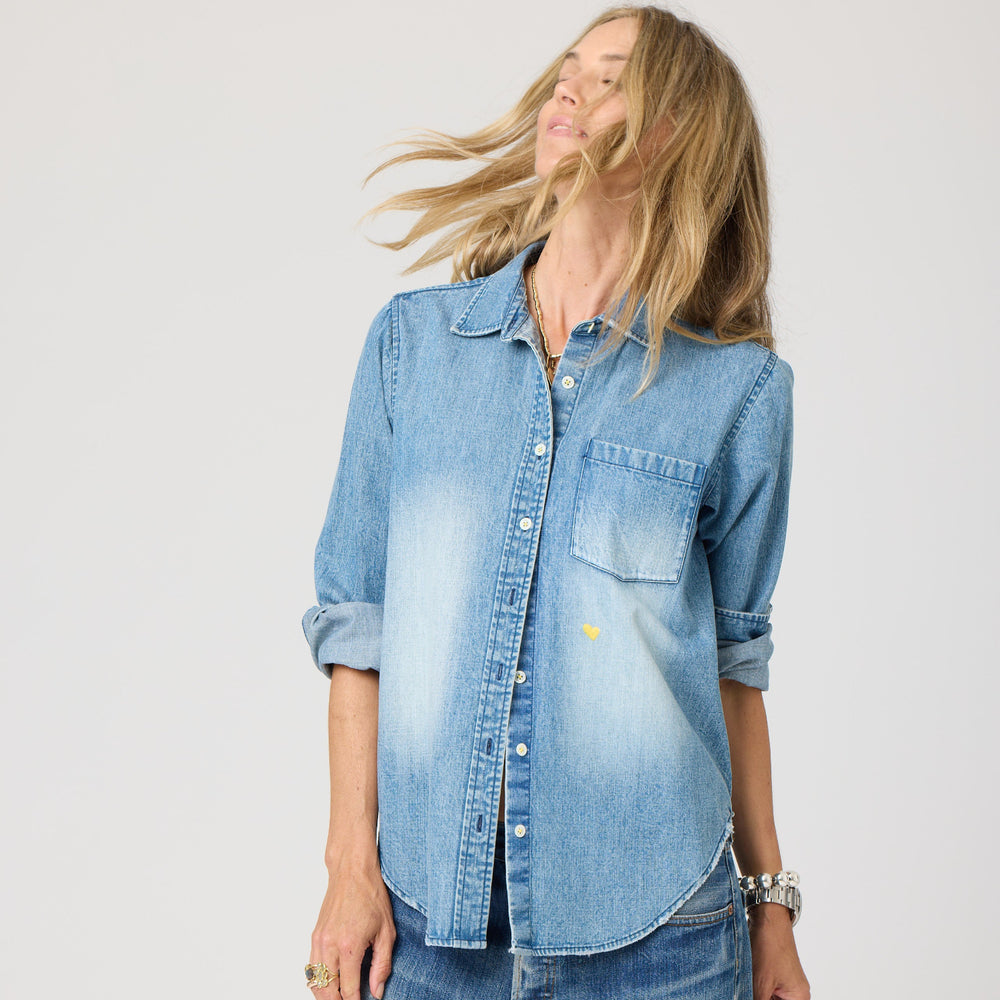 Blue denim long sleeve button-up shirt with heart elbow patches. Cute designer shirts by Kerri Rosenthal