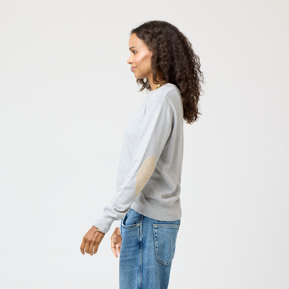 Grey patchwork crewneck sweater with imperfect heart patches on elbows in a soft cotton-cashmere blend. Cute women's sweaters by Kerri Rosenthal