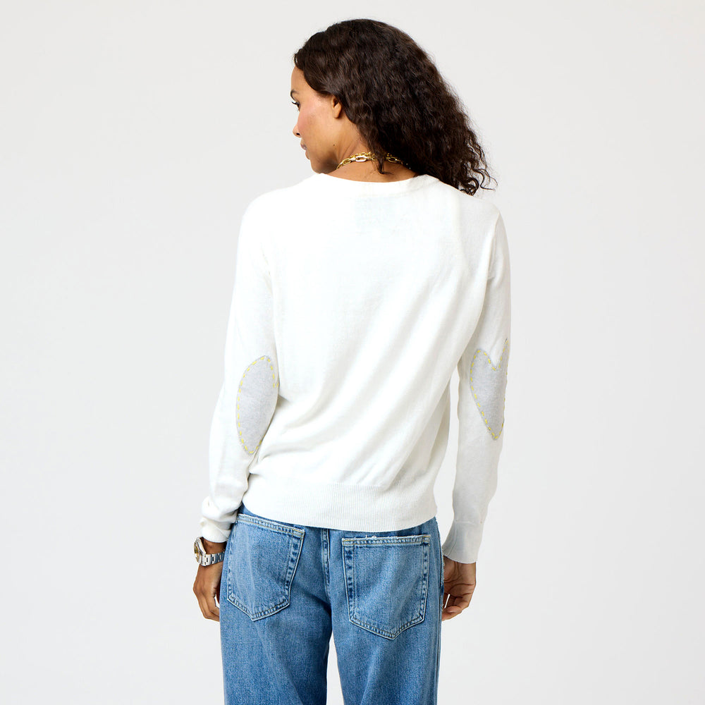 White Patchwork Crew Neck Sweater with imperfect heart patches on elbows in a soft cotton-cashmere blend. Cute women's sweaters by Kerri Rosenthal