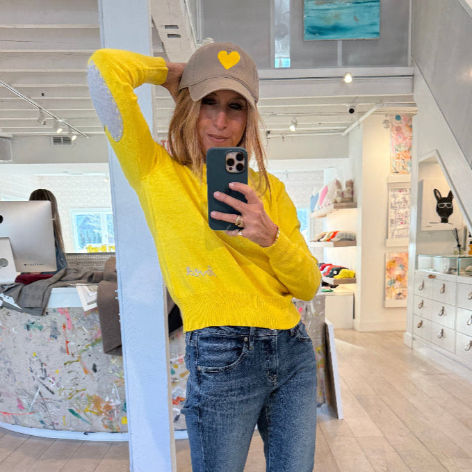 Yellow Patchwork Crewneck Sweater with imperfect heart patches on elbows in a soft cotton-cashmere blend. Cute women's sweaters by Kerri Rosenthal
