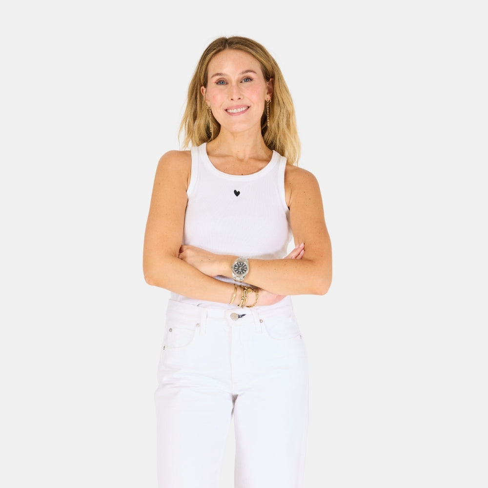 The KR white tank top is in a cotton blend with a tiny embroidered heart - Shop cute designer women’s tank tops by Kerri Rosenthal