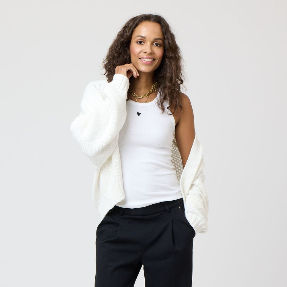The KR white tank top is in a cotton blend with a tiny embroidered heart - Shop cute designer women’s tank tops by Kerri Rosenthal