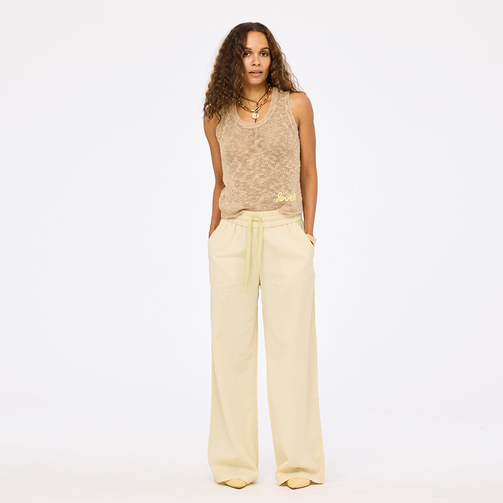 Beige wide leg palazzo pants in 100% cotton blend with beige sweater tank top and an elastic waist by Kerri Rosenthal
