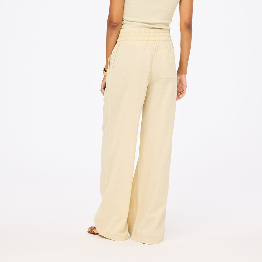 Beige wide leg cotton palazzo pants in 100% cotton blend with heart embroidery and an elastic waist by Kerri Rosenthal