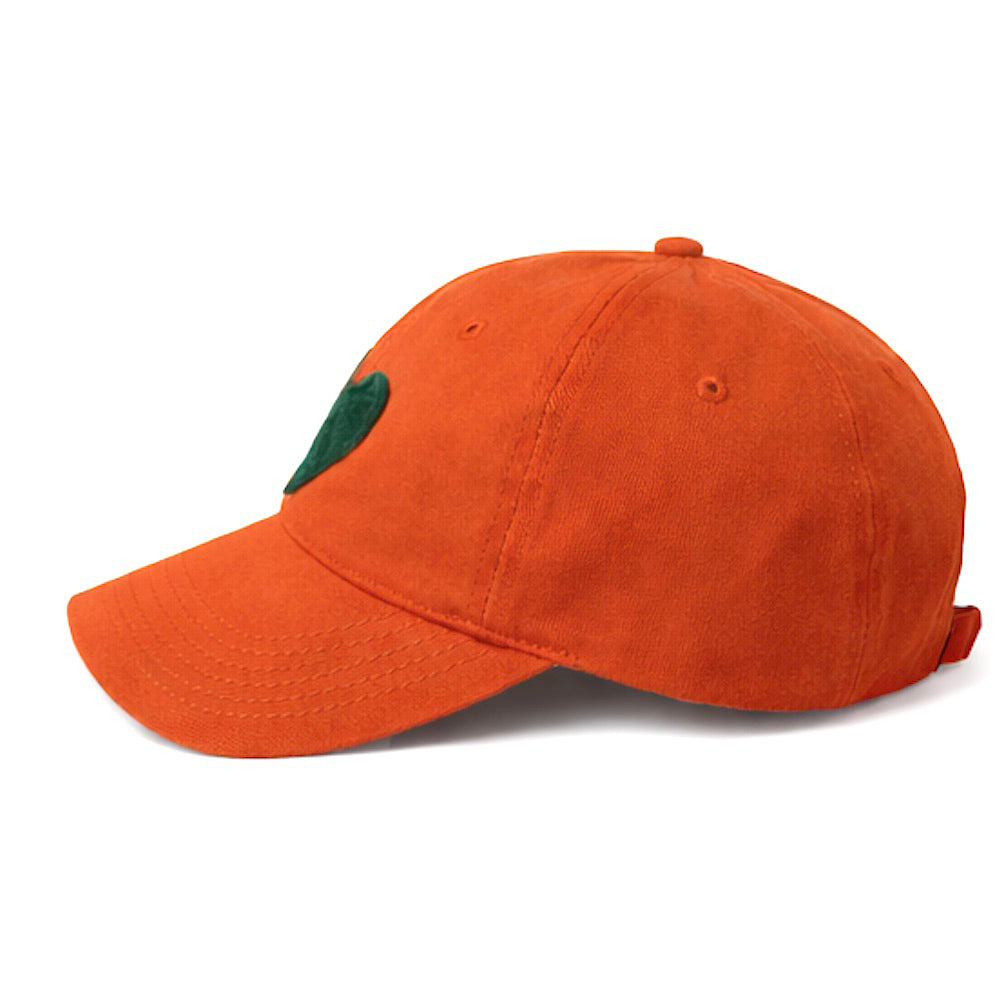 Kerri Rosenthal Imperfect Heart baseball cap in orange with green felt heart patch, side view