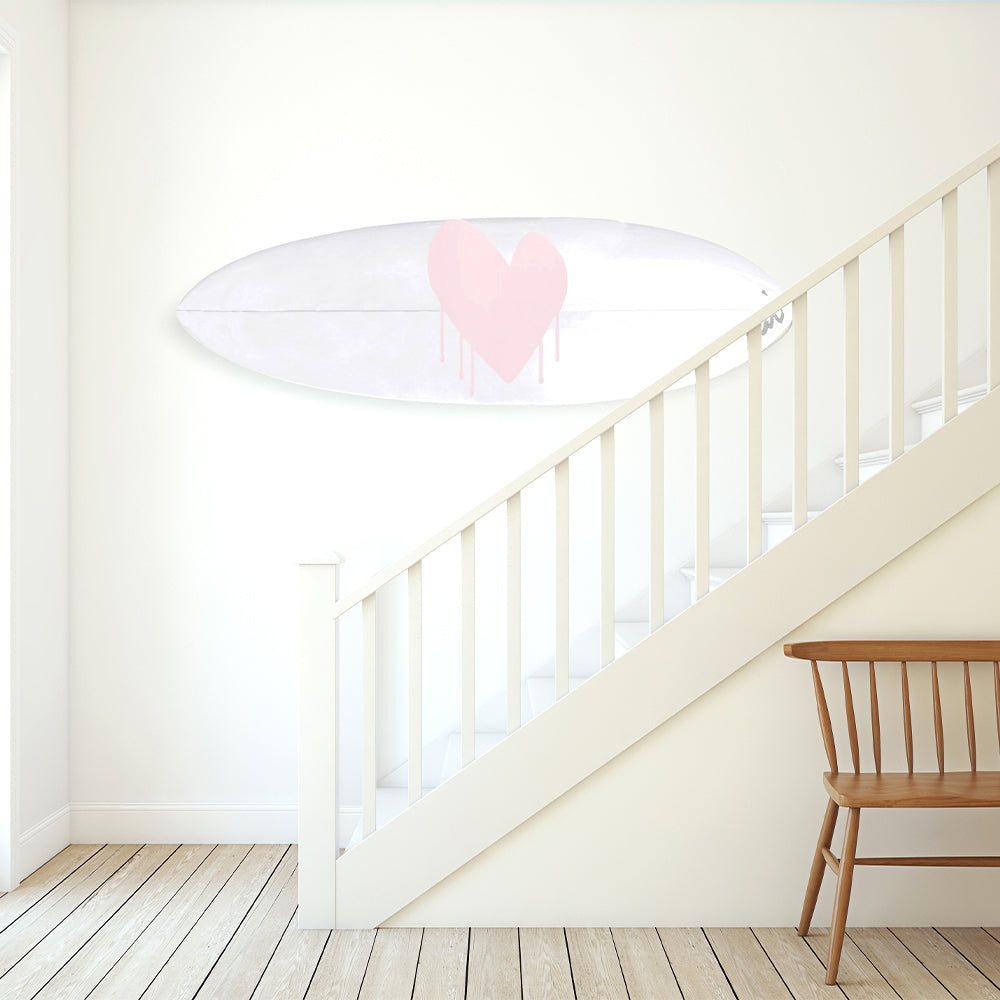Custom surfboard with dripping heart artwork by Kerri Rosenthal