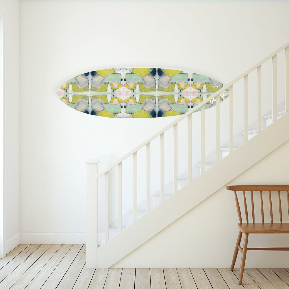 This colorful surfboard is handmade by surfers and signed by Kerri, combining artistry and coastal lifestyle.