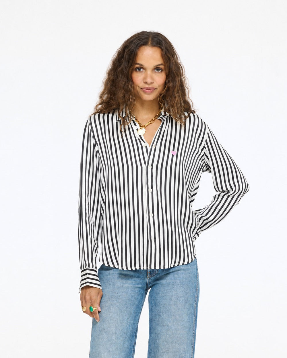 Model wearing the Keaton Stripe Shirt in cream and black stripe with jeans, front view