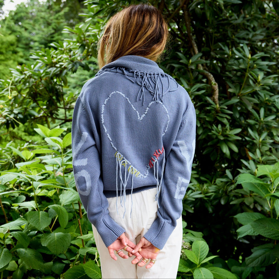 Kerri Rosenthal heart fringe cardigan in blue - back view with hand-stitched heart detail