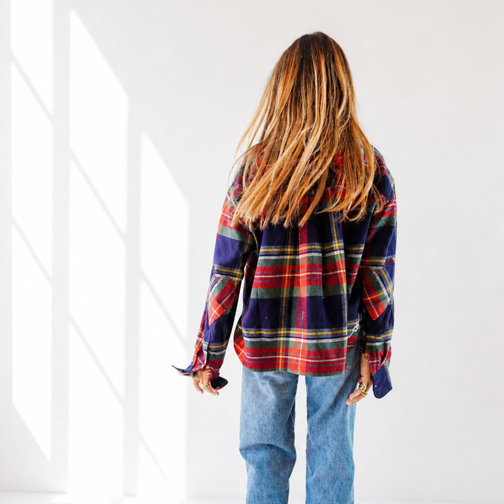 Kerri wearing the Tia Flannel Shirt in plaid with jeans, back view