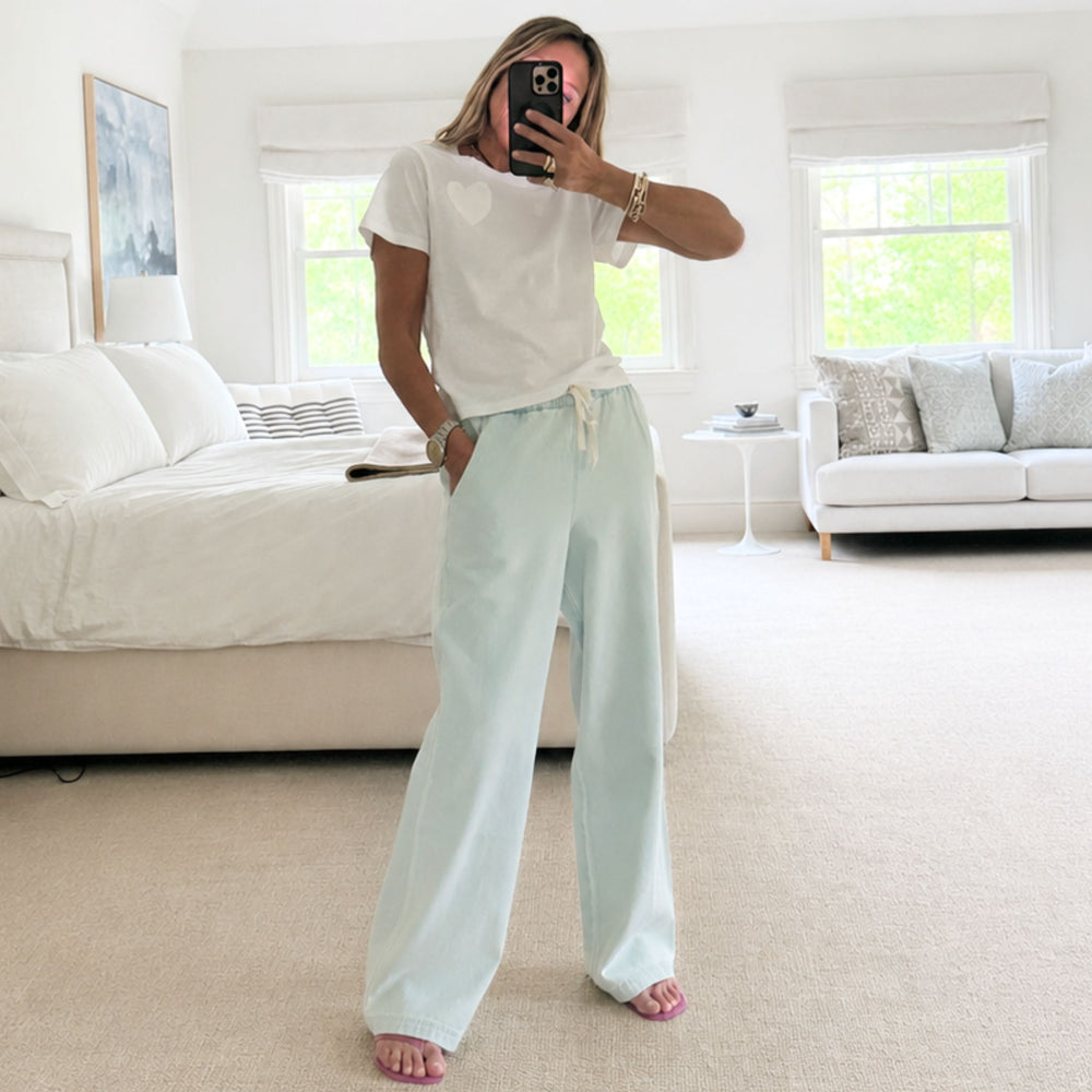 Light blue wide leg palazzo pants in 100% cotton denim with light denim jacket by Kerri Rosenthal