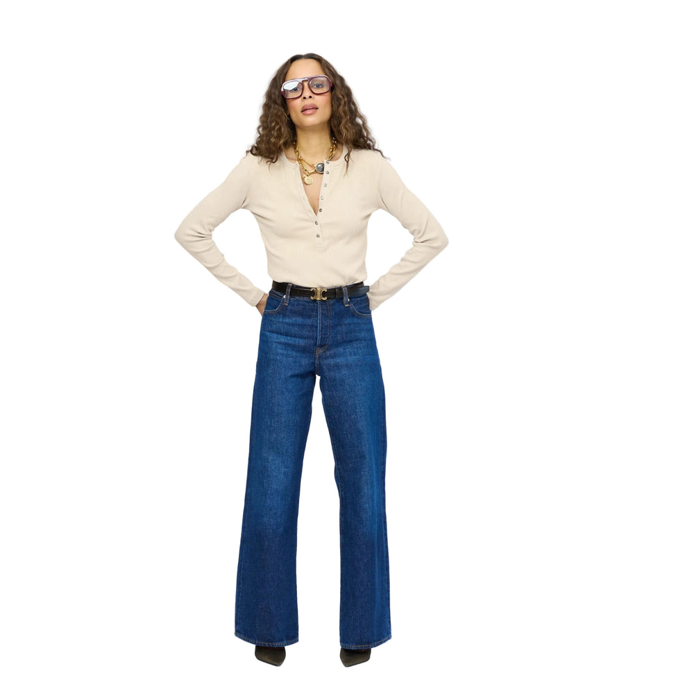 Kerri Rosenthal ivory rib henley and wide-leg jeans, full-length front view with hands on hips