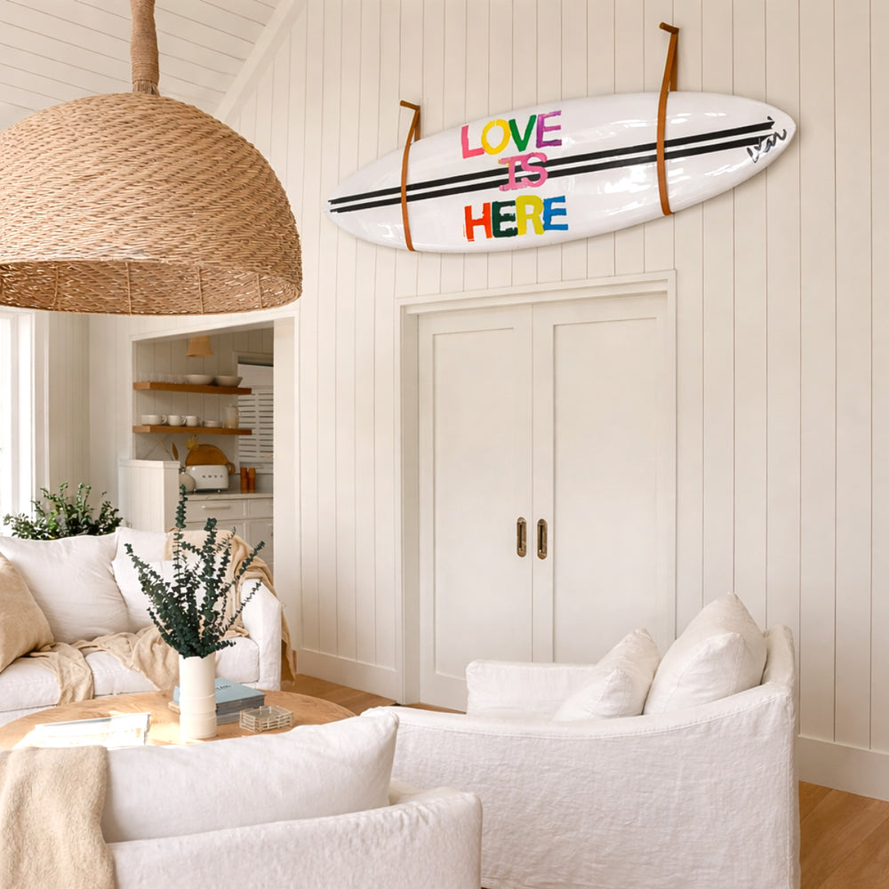 A multicolor surfboard craft that makes a bold, loving statement, whether it's hung on the wall or catching waves.
