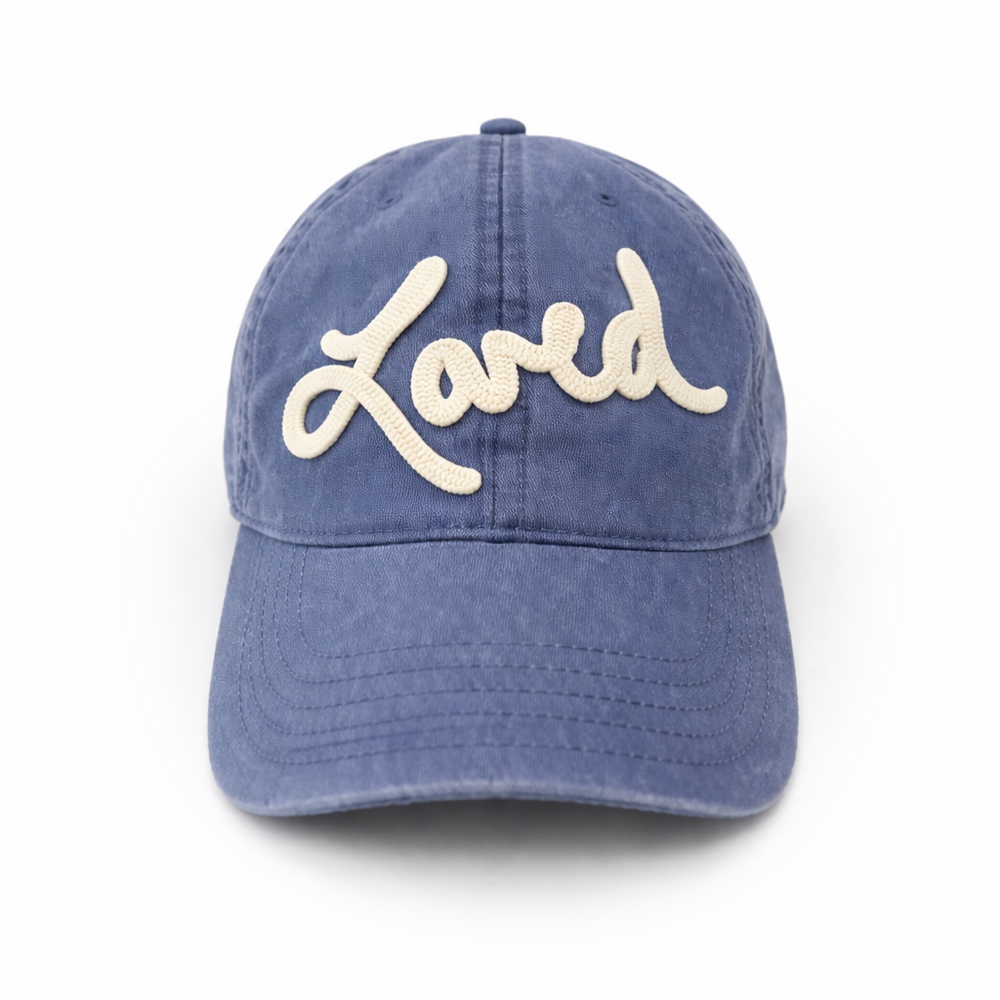 Loved Baseball Hat in washed blue with 'Loved' embroidered in cream script, front view