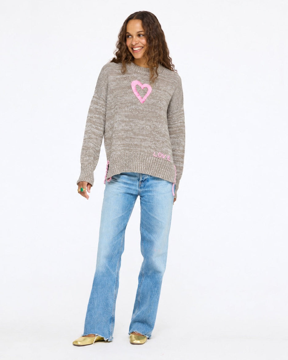 Model wearing the Lovey Heart Pullover in taupe with wide-leg jeans, full length front view