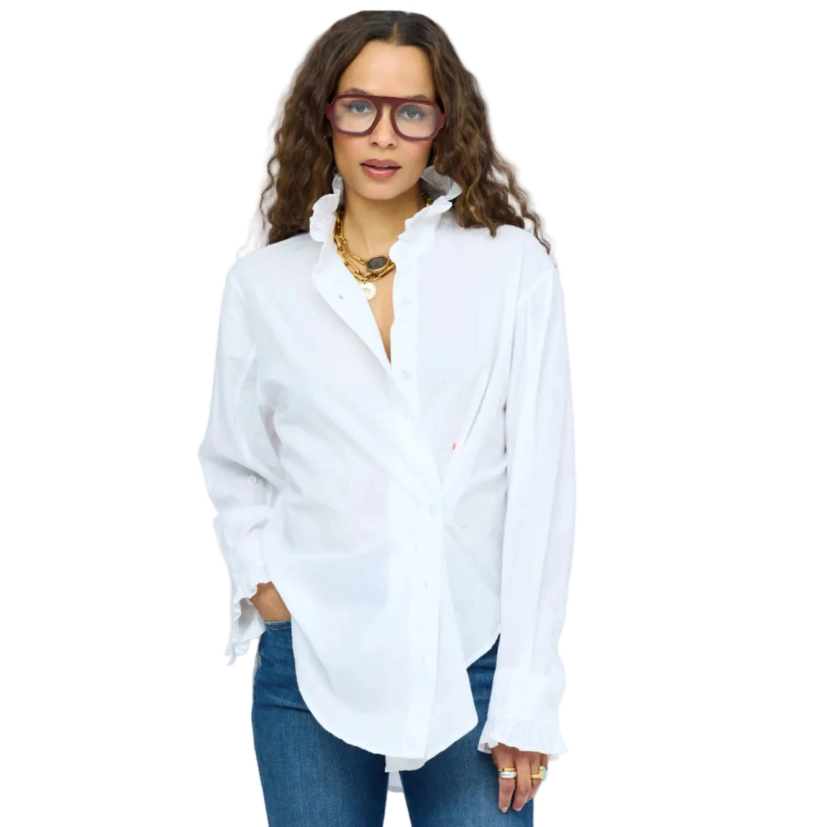 Close, straight-on shot of model wearing dark red glasses and a Kerri Rosenthal white ruffle-collar shirt with ruffled cuffs, gold layered necklaces visible, neutral expression.