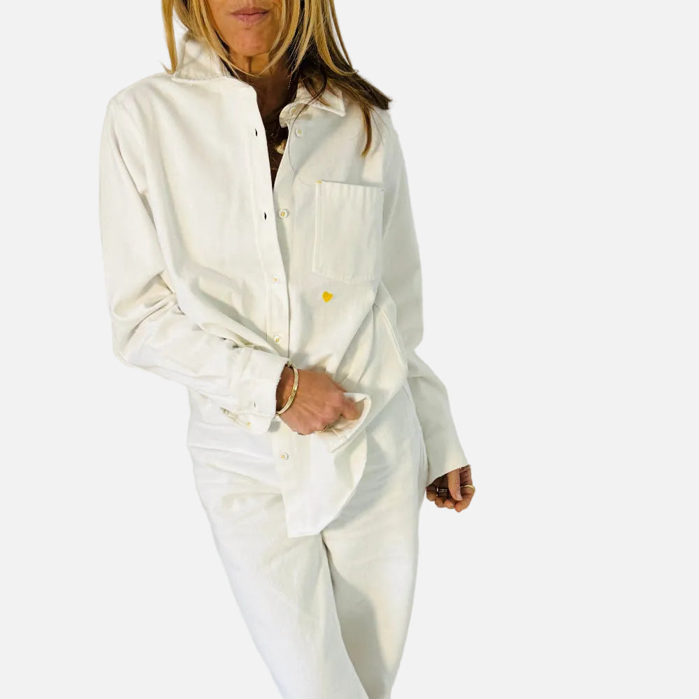 Mia denim button-up white shirt with a tiny embroidered heart detail and heart elbow patches by Kerri Rosenthal
