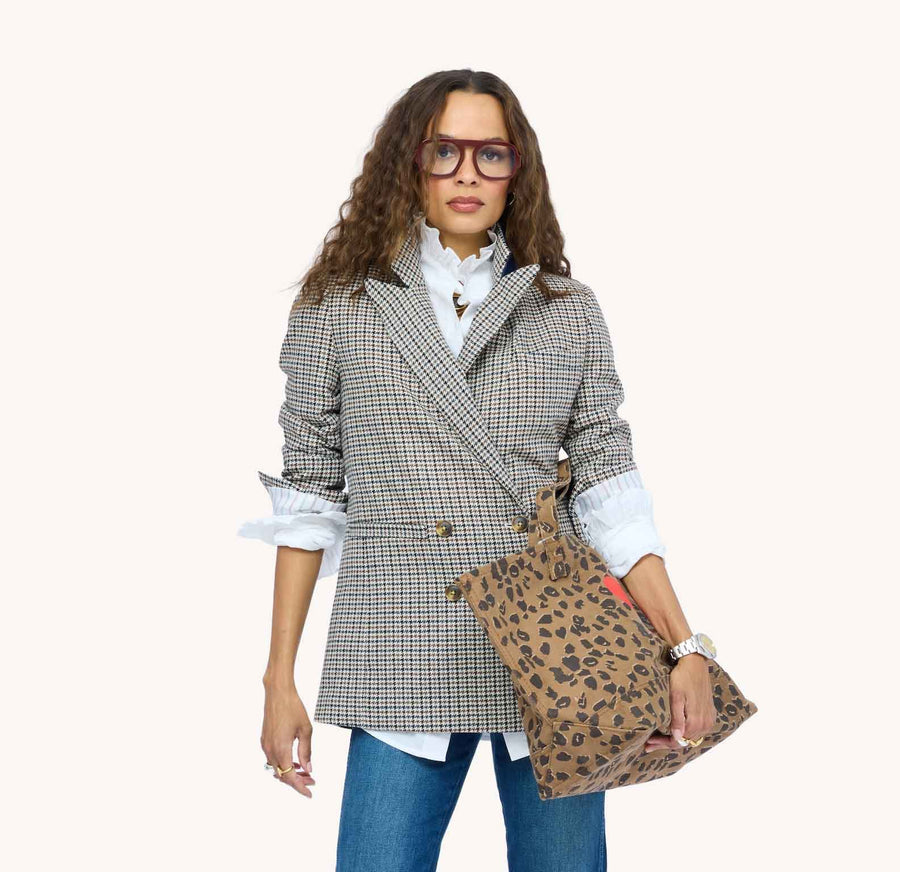 Model wearing Mr Frenchie Blazer and carrying Nomad Tote in animal print, front view