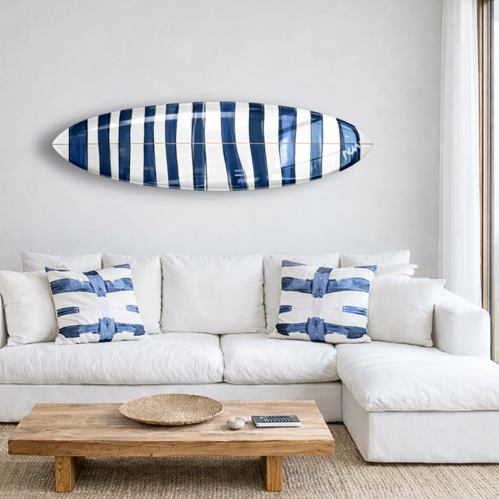 Navy blue and white summer stripes surfboard with linen throw pillows on couch by Kerri Rosenthal
