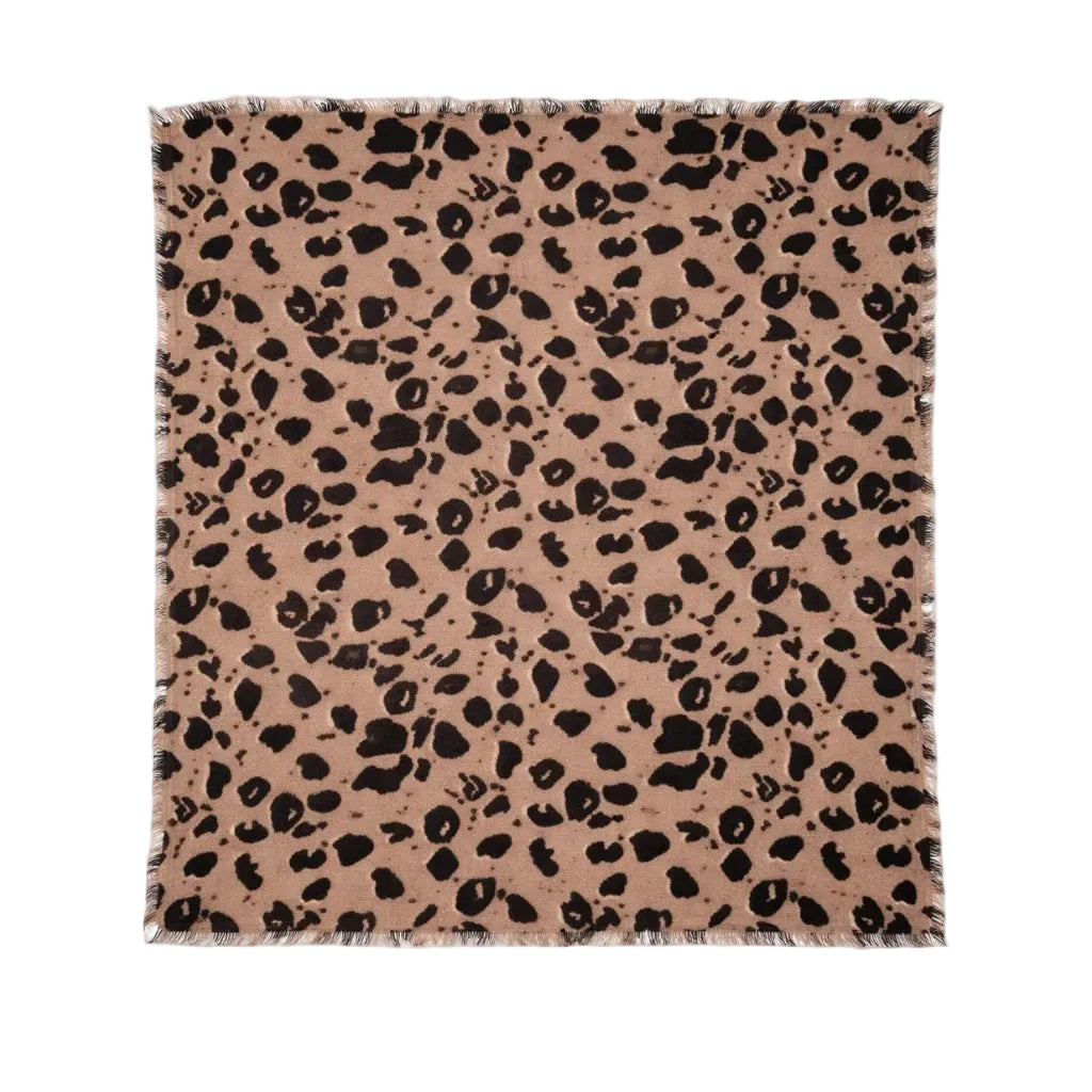 Kerri Rosenthal leopard print cashmere bandana flat lay showing full pattern and fringe trim