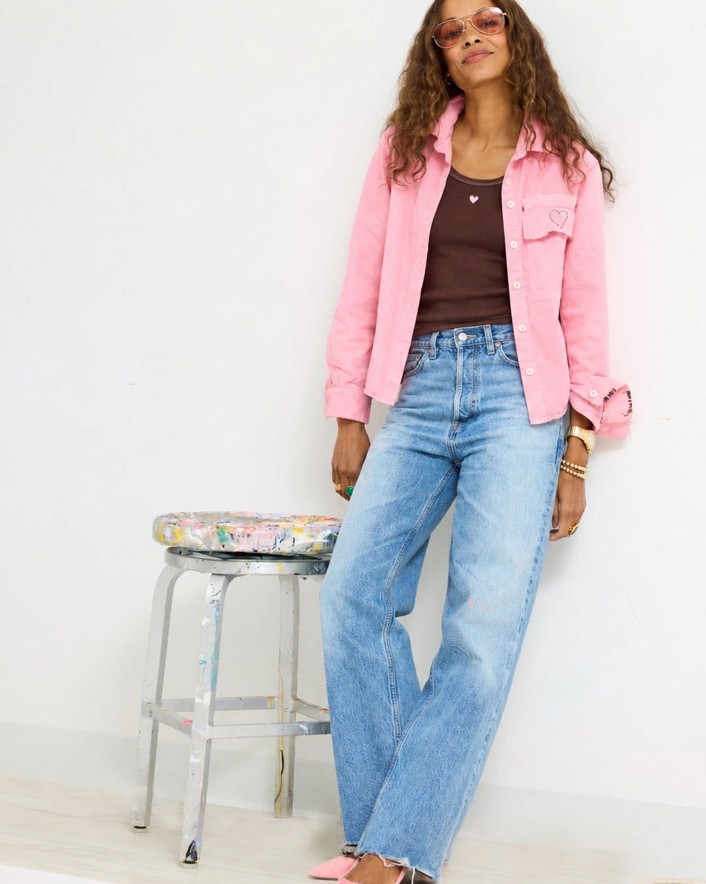 Model wearing the KR Tank in brown under the Pia Fireside and Kisses Shirt in pink worn open, with jeans, front view