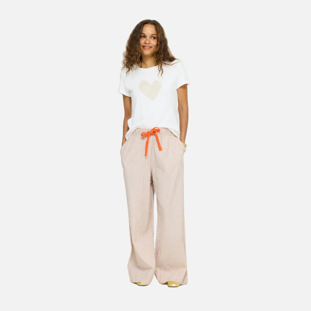 Beige pants for ladies in cotton linen with pockets. Suke Heart Tee. Shop women's cute trouser pants by Kerri Rosenthal.