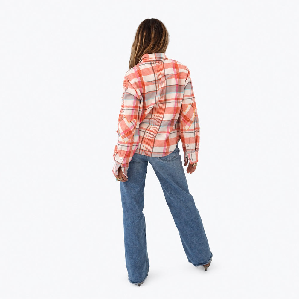 Kerri wearing the Pia Flannel Shirt in coral plaid with jeans, back view