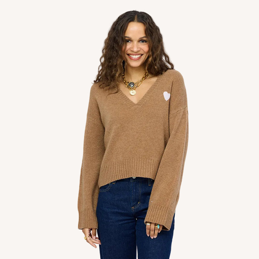Model wearing Saturday V-Neck, an easy, relaxed-fit 100% cashmere sweater in teddy brown, front view.