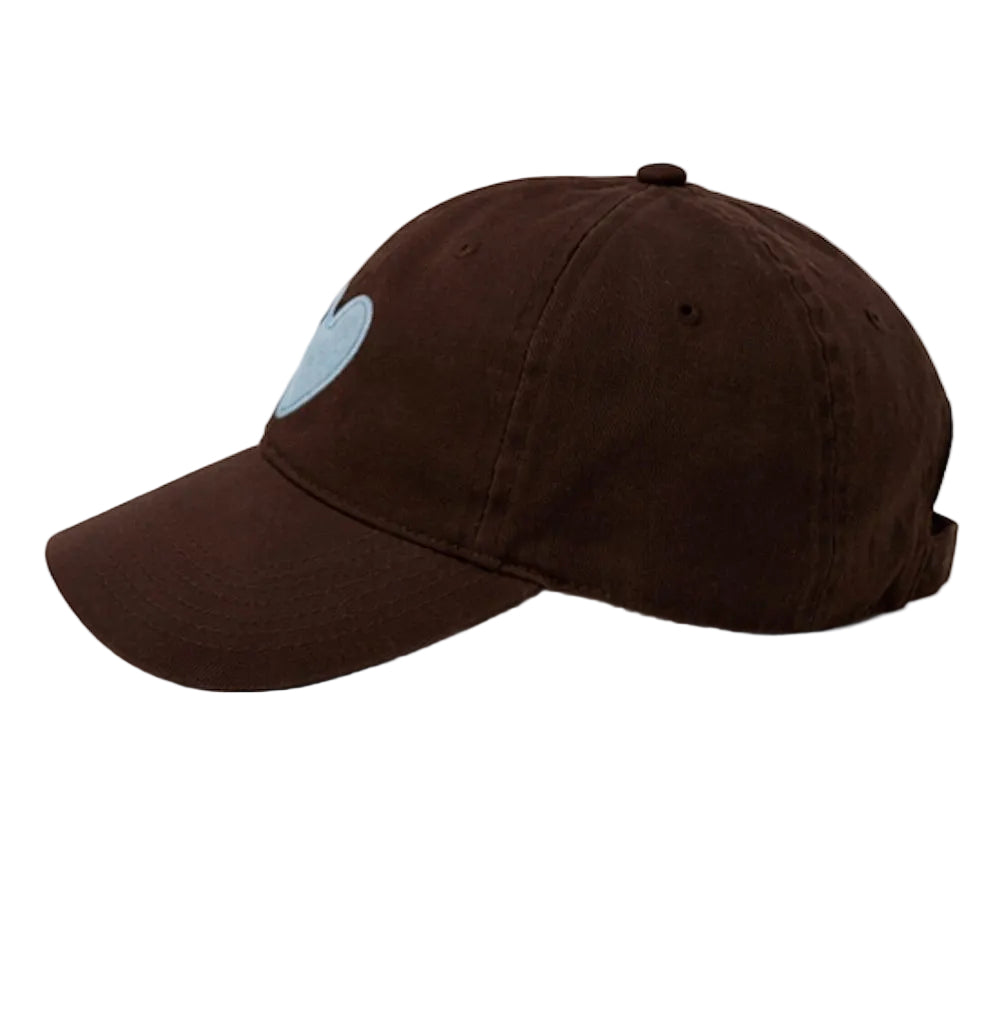 Side view of Kerri Rosenthal Imperfect Heart baseball cap in brown with blue heart patch