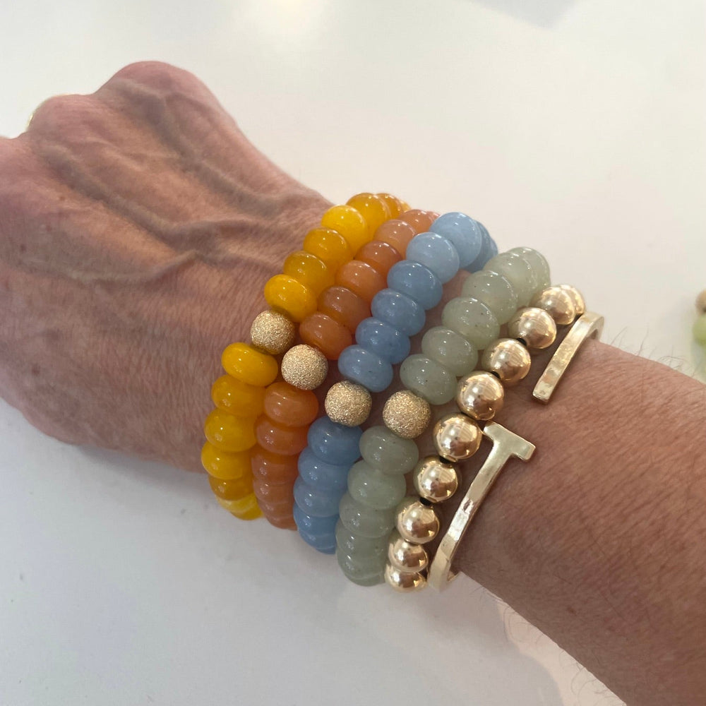 Seally Mimi colourful bracelet is made from smooth semi-precious stones - Jade & a 14K gold-plated bead is handmade in Switzerland