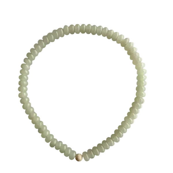 Seally Mimi pistachio glow green necklace is made from tinted quartz & a 18K gold-plated bead  handmade in Switzerland