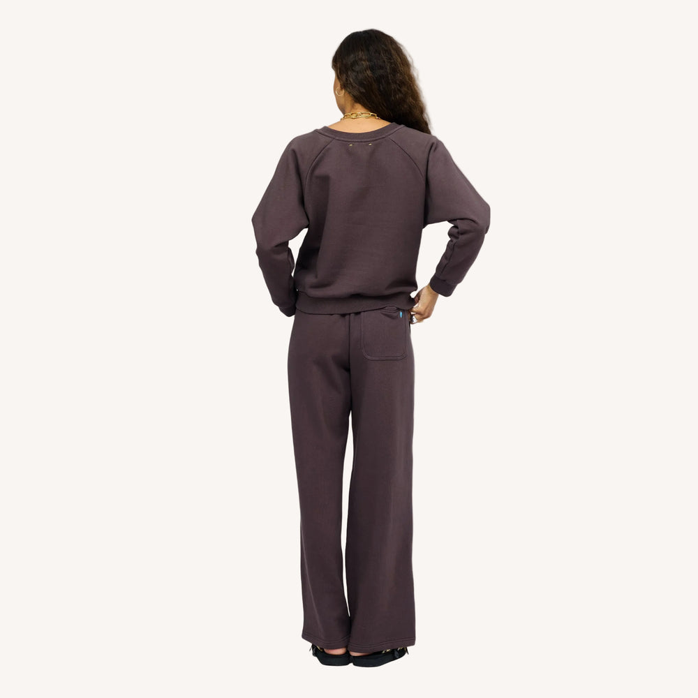 Model wearing True Sweatshirt in Cocoa styled with Super Soft Fleece Weekend Palazzo, back view.