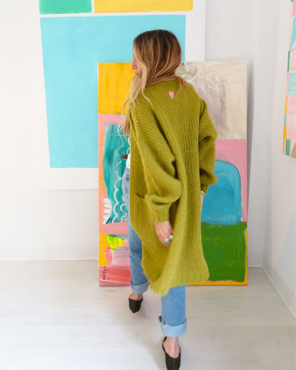 Kerri Rosenthal olive alpaca duster side profile showing oversized silhouette and length