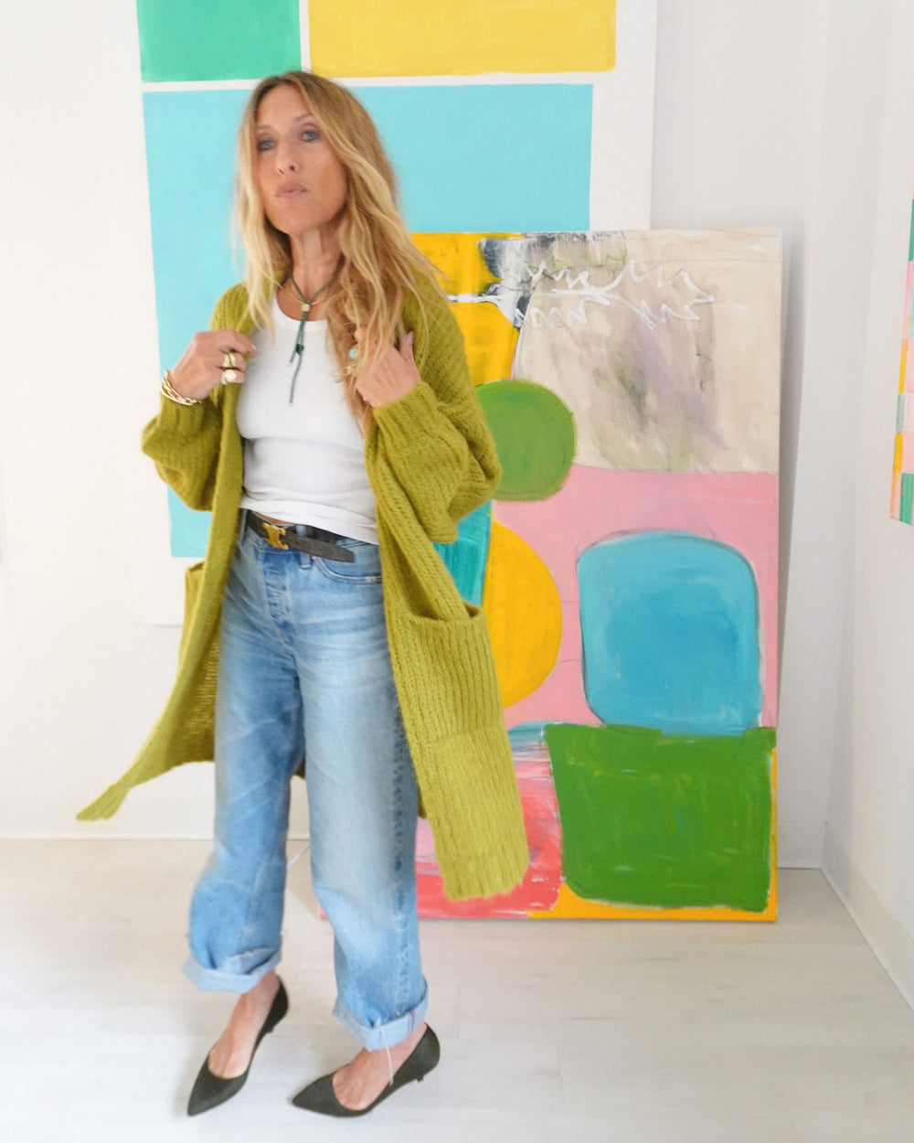 Kerri Rosenthal olive alpaca Sienna Duster with patch pockets, worn open over jeans, front view