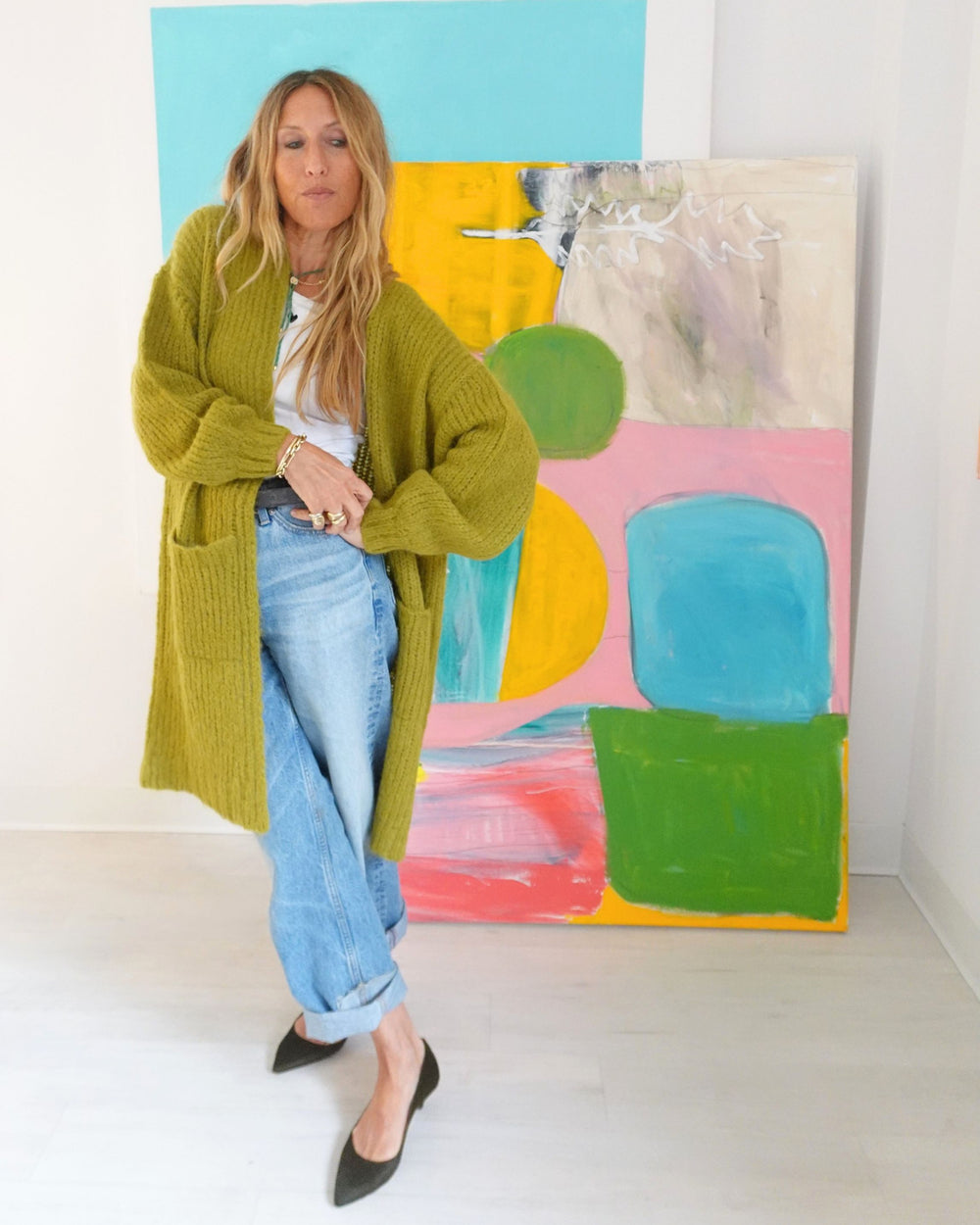 Kerri Rosenthal olive alpaca Sienna Duster with patch pockets, worn open over jeans, front view