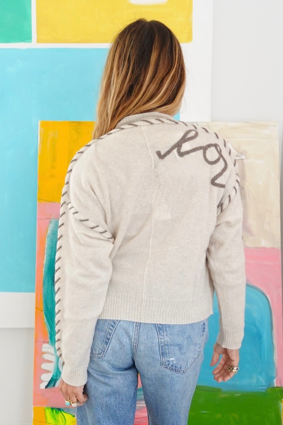 Kerri Rosenthal ivory sweater back view with contrast stitch sleeve detail, 