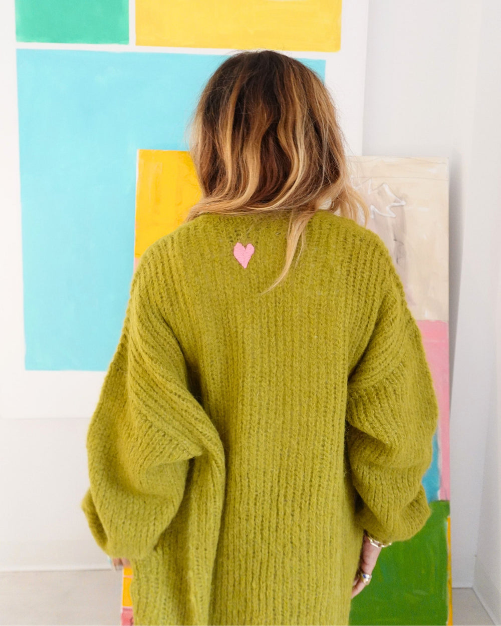 Kerri Rosenthal olive alpaca sweater with pink heart on back 