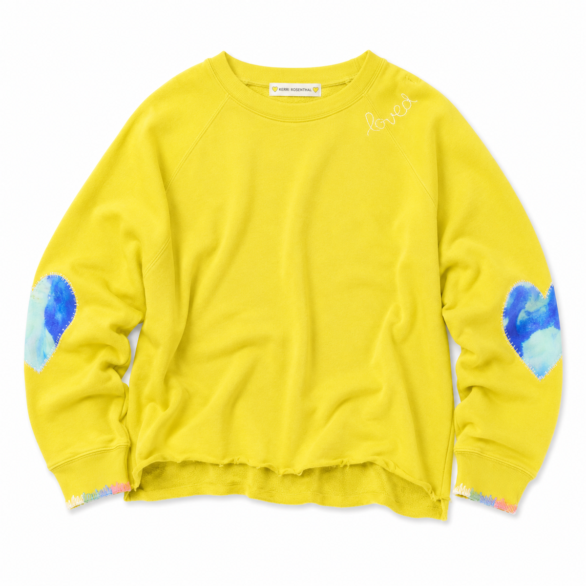 Front view of flat lay of a chartreuse sweatshirt with paint splat heart elbow patchwork and paint cuff trim.