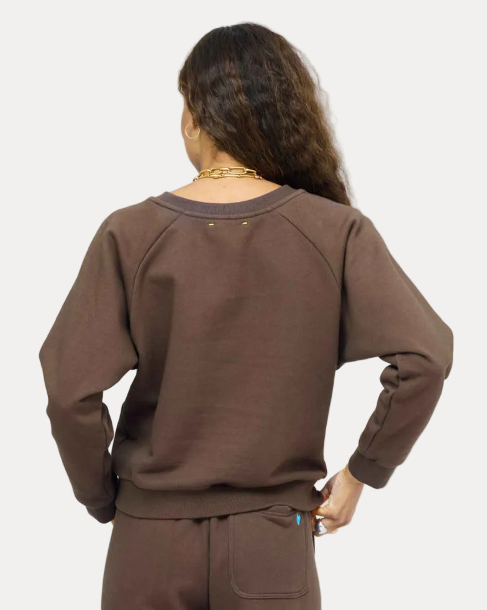 Model wearing True Sweatshirt in Cocoa styled with Super Soft Fleece Weekend Palazzo, back view.